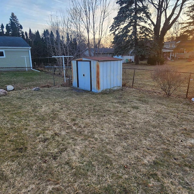 view of shed with a fenced backyard