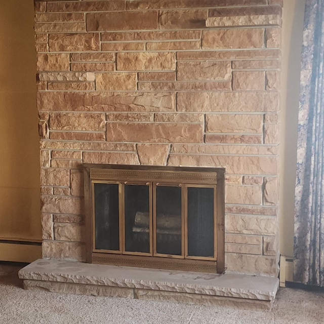 room details featuring a glass covered fireplace