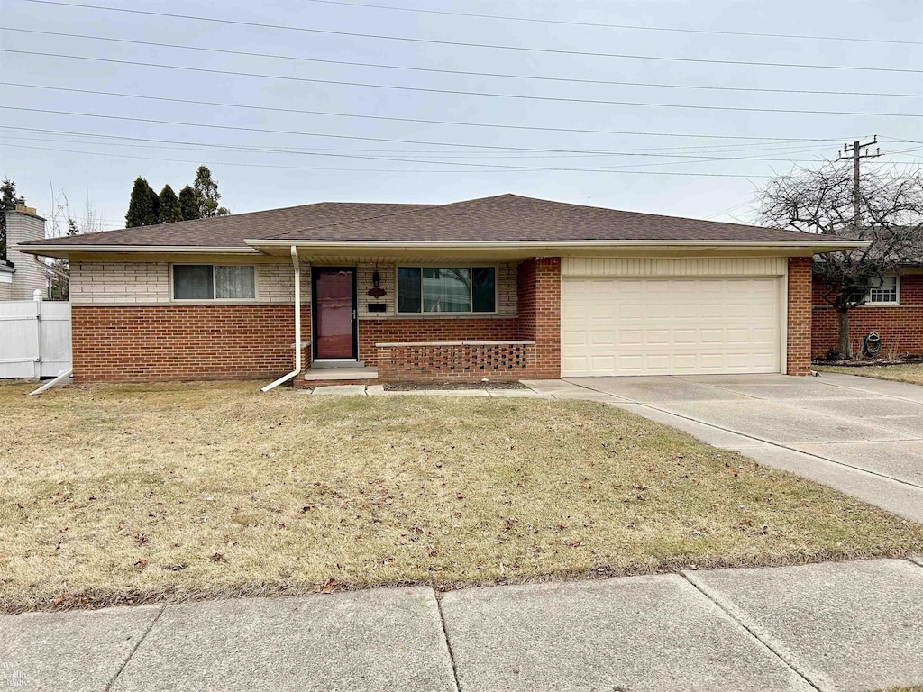 single story home with brick siding, roof with shingles, concrete driveway, an attached garage, and a front lawn