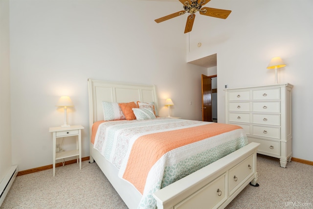 bedroom with a ceiling fan, a baseboard radiator, light carpet, and baseboards