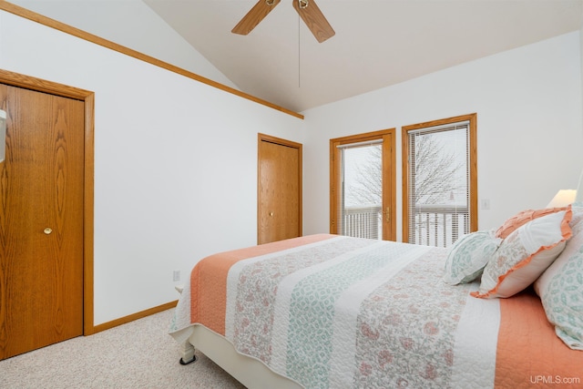 bedroom with carpet, baseboards, vaulted ceiling, and a ceiling fan