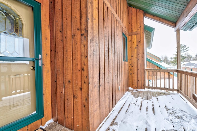 view of snow covered property entrance