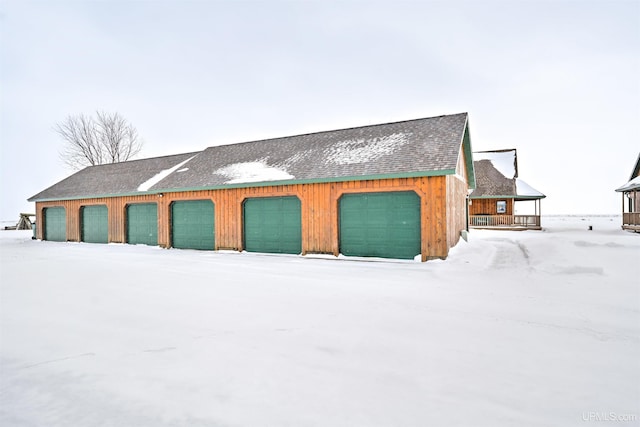 view of snow covered garage