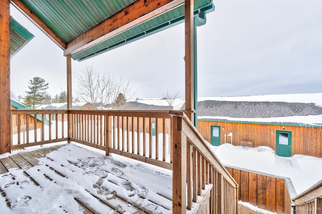 view of snow covered deck