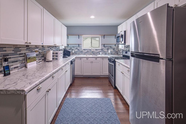 kitchen featuring stainless steel appliances, dark wood-type flooring, backsplash, and open shelves