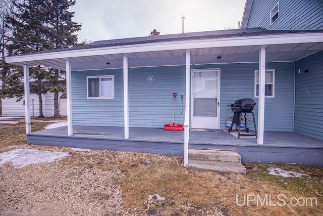 entrance to property with covered porch