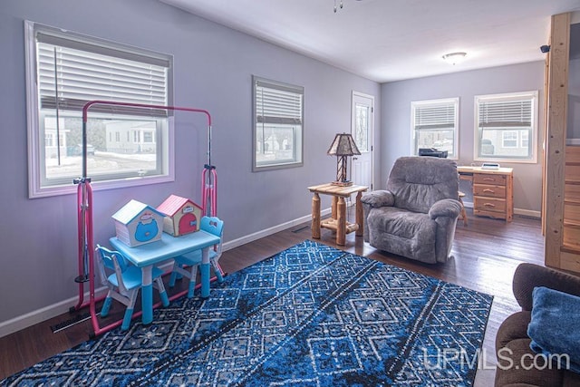 game room with wood finished floors and baseboards