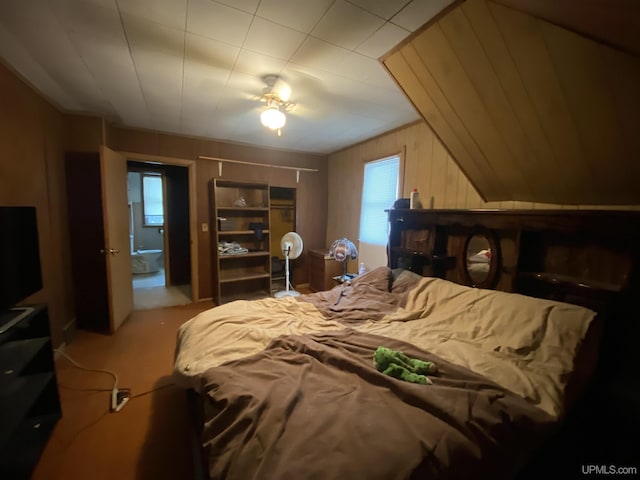 bedroom with wooden walls