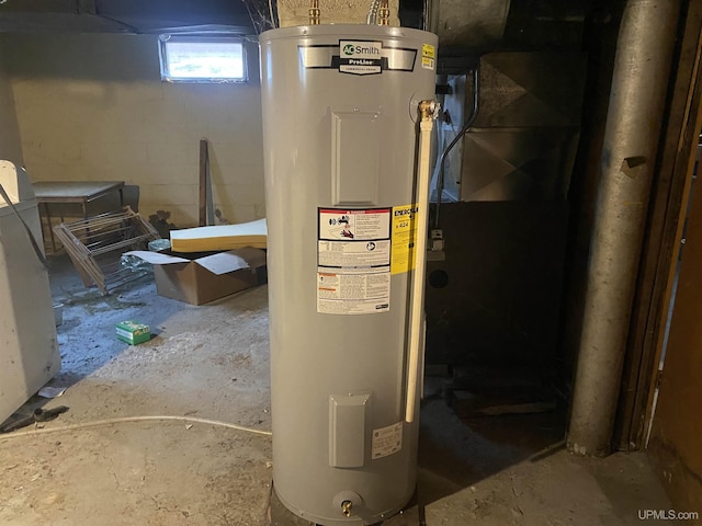 utility room featuring electric water heater