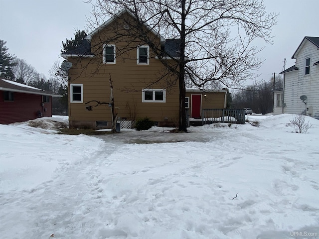 view of snow covered house