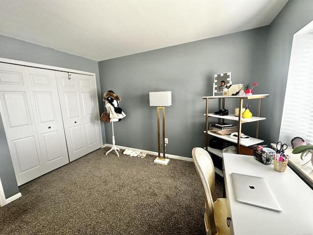 carpeted office featuring baseboards