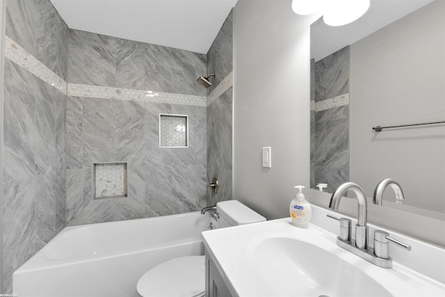 bathroom with vanity, toilet, and shower / tub combination