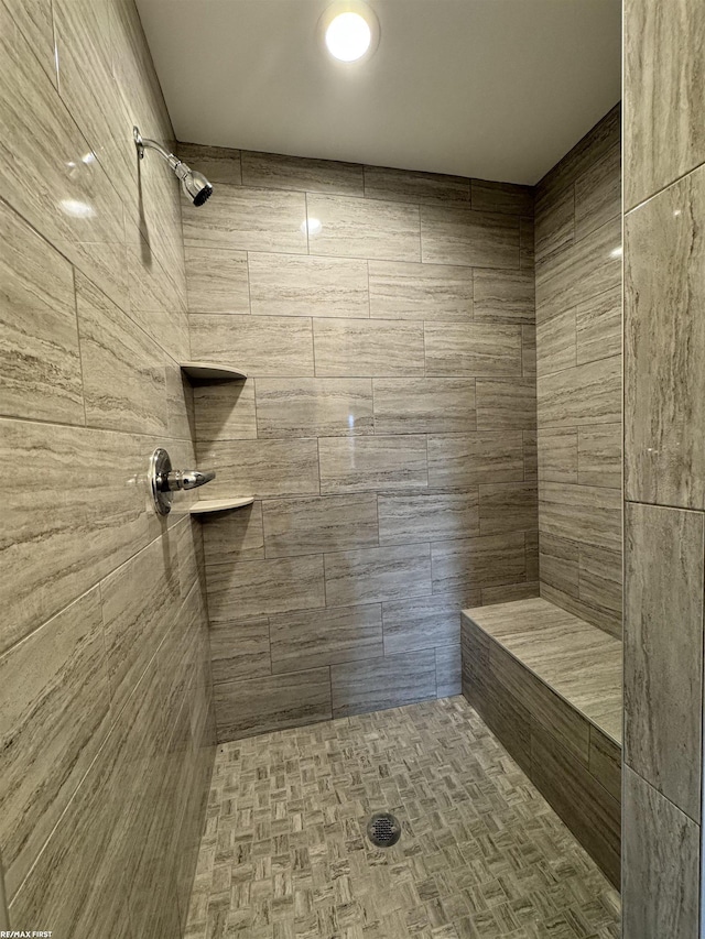 full bathroom with tiled shower