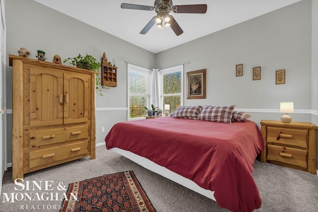 bedroom with carpet flooring, baseboards, and ceiling fan