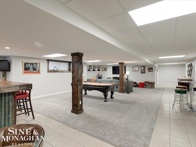 recreation room with pool table, baseboards, light colored carpet, light tile patterned floors, and a paneled ceiling