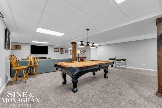 recreation room featuring a drop ceiling, carpet floors, baseboards, and tile patterned flooring