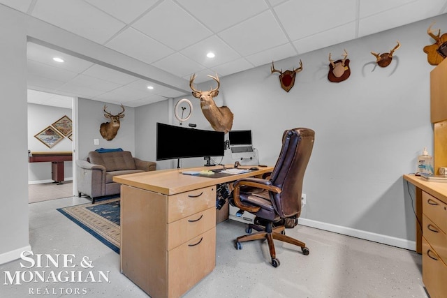 home office with recessed lighting, baseboards, and a drop ceiling