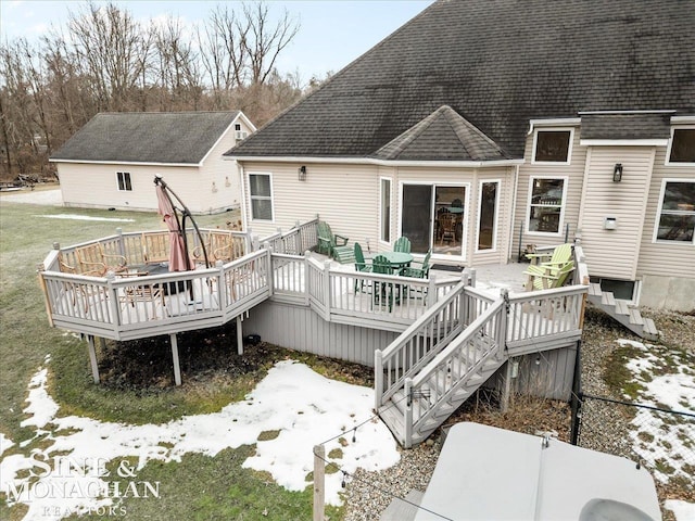 rear view of house with a wooden deck, stairway, and a shingled roof