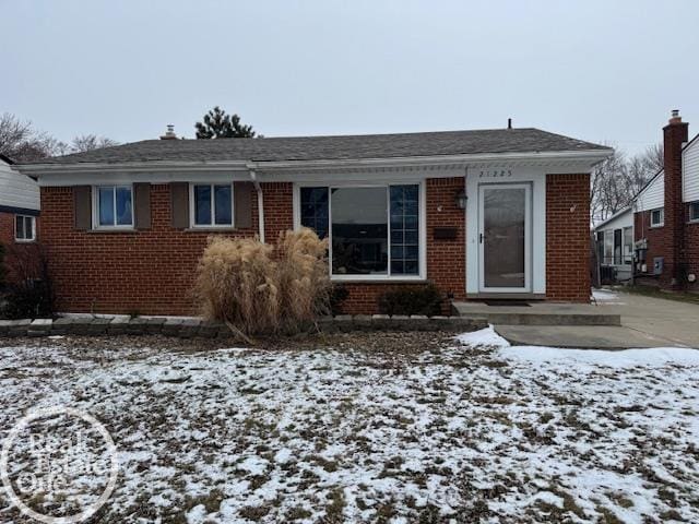 view of front of home featuring brick siding