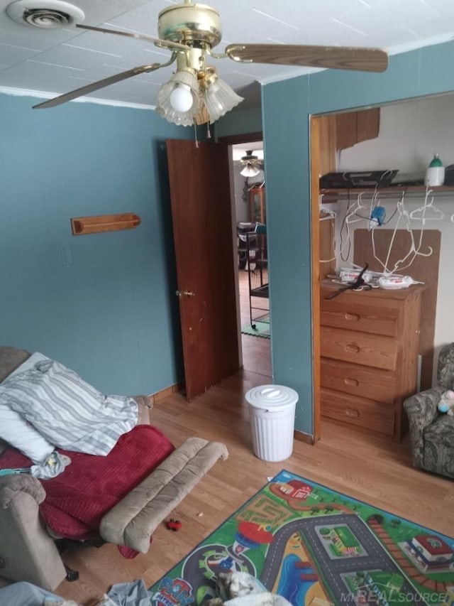 bedroom with wood finished floors and visible vents