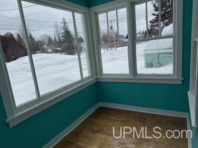 unfurnished sunroom featuring a healthy amount of sunlight