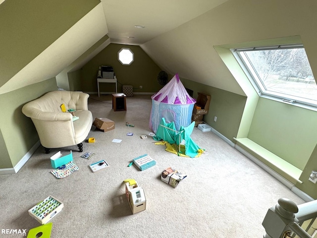 rec room with baseboards, carpet floors, and vaulted ceiling