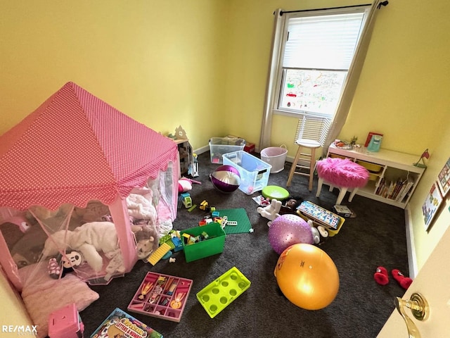 playroom with carpet and baseboards