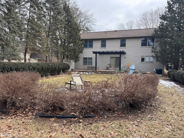 rear view of house with cooling unit