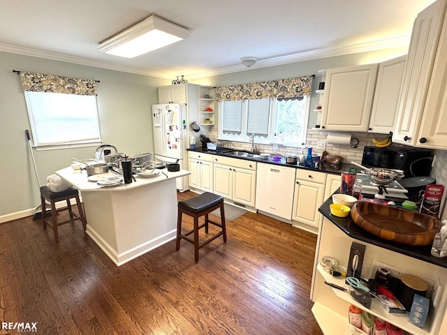 kitchen featuring open shelves, dark wood-style flooring, white appliances, and a sink