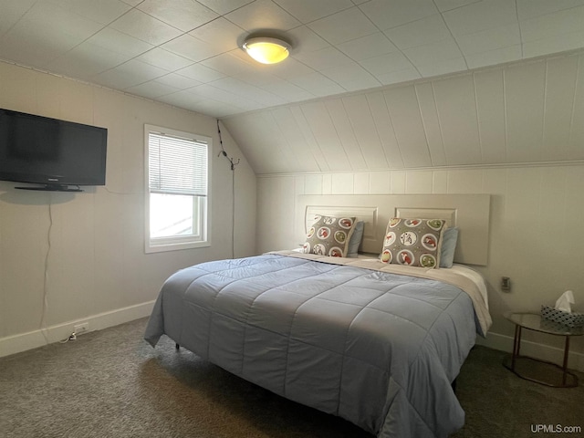 bedroom with carpet flooring, baseboards, and vaulted ceiling