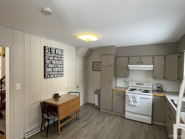 kitchen with white range with electric cooktop, gray cabinets, light countertops, under cabinet range hood, and light wood-type flooring