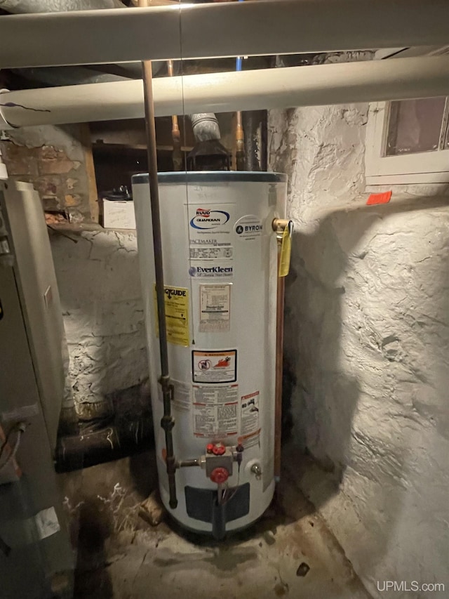 utility room featuring gas water heater