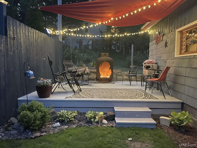 view of patio featuring fence