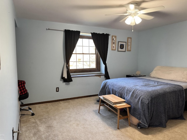 carpeted bedroom featuring a ceiling fan and baseboards