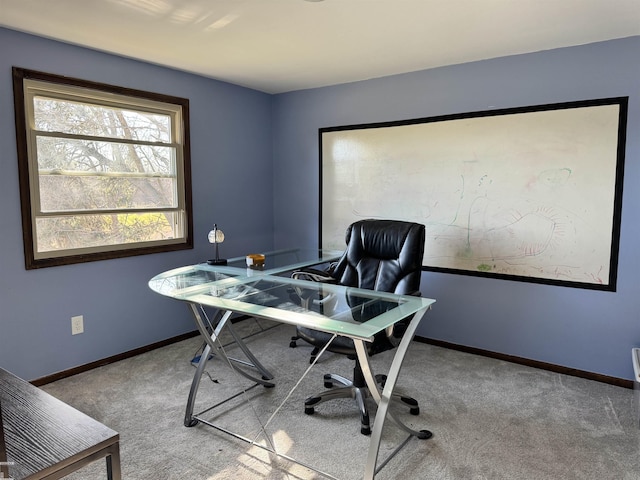 office space with carpet flooring and baseboards