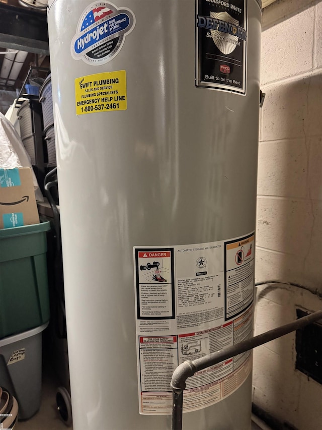 utility room with gas water heater