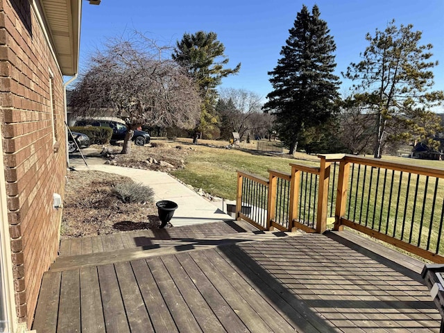 wooden deck with a yard