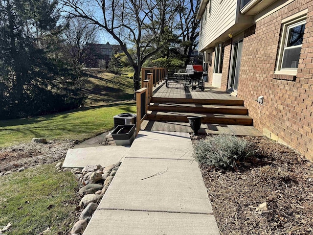 deck featuring a lawn