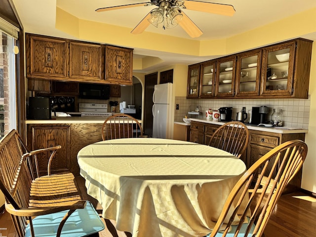 interior space with ceiling fan and wood finished floors