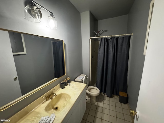 bathroom featuring tile patterned flooring, toilet, vanity, and a shower with curtain