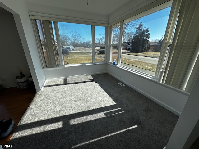 sunroom / solarium featuring visible vents