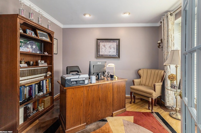 office area featuring wood finished floors, baseboards, and ornamental molding