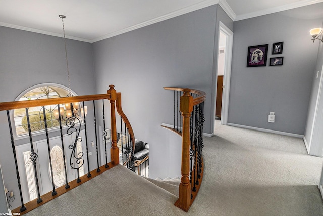 corridor featuring carpet, baseboards, crown molding, an upstairs landing, and a chandelier