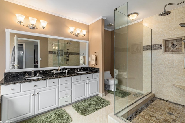 bathroom featuring a sink, toilet, ornamental molding, and a shower stall