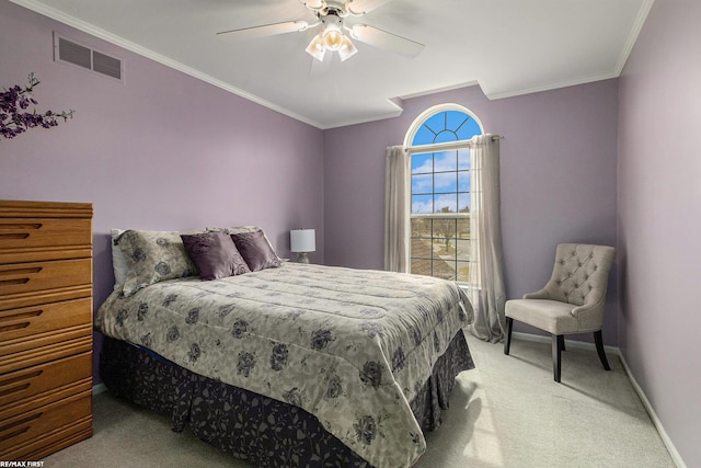 bedroom with visible vents, baseboards, light colored carpet, ornamental molding, and a ceiling fan