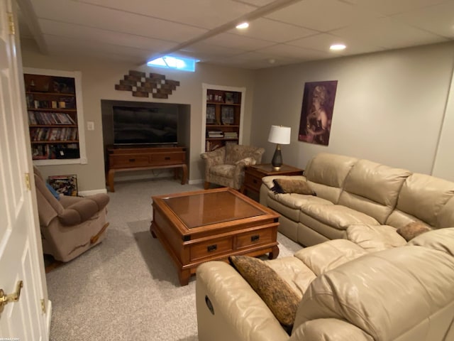 living room with light carpet and recessed lighting