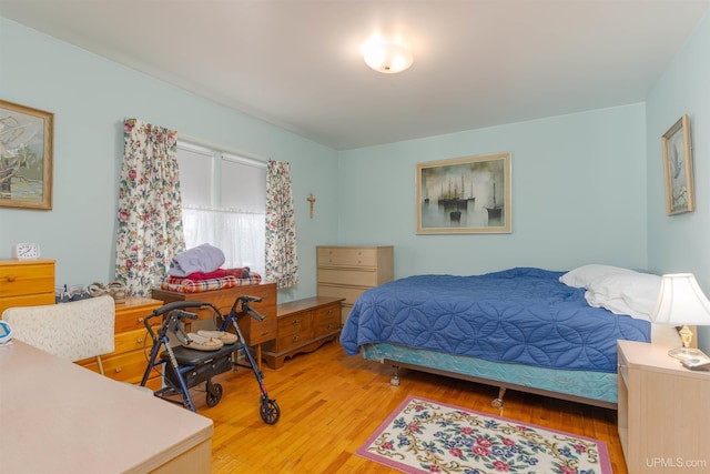 bedroom with light wood-type flooring