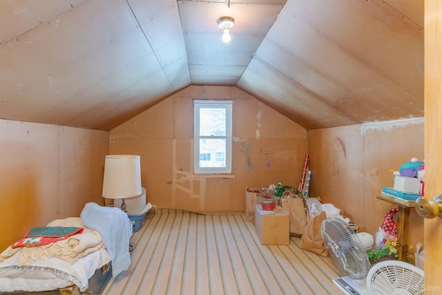 additional living space featuring vaulted ceiling and carpet flooring