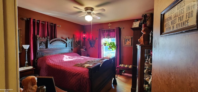 bedroom with ceiling fan and wood finished floors