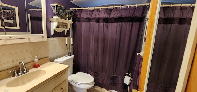 full bathroom featuring toilet, curtained shower, backsplash, tile walls, and vanity